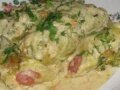Рецепт Сосиски в капустных листьях с сыром в сметанном соусе